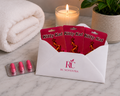 Kitty Kat products in red packaging with RC Noventra branding on a marble surface.